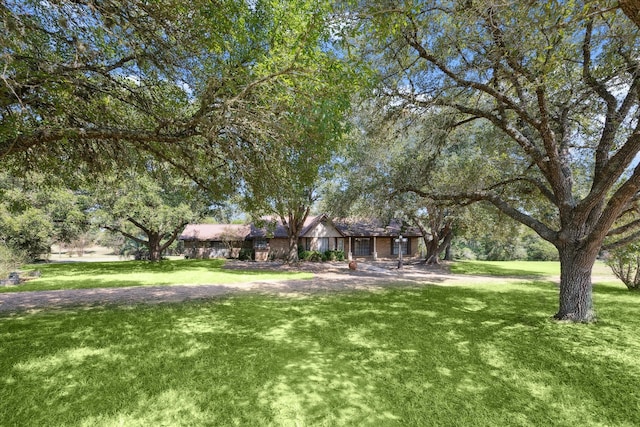 exterior space featuring a front lawn