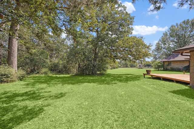 view of yard with a deck