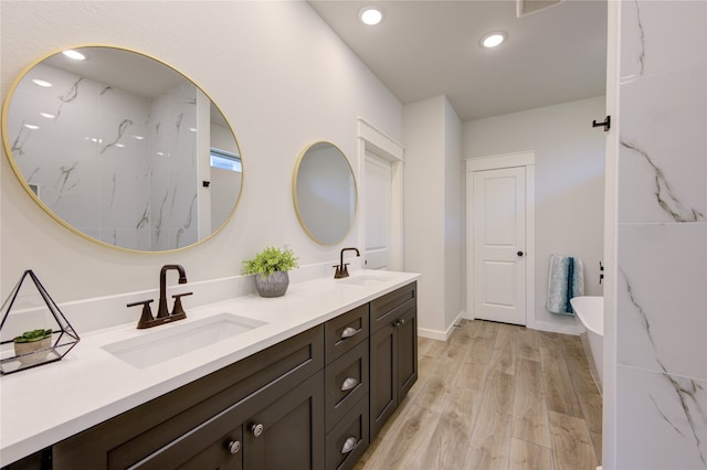 bathroom with vanity and hardwood / wood-style flooring