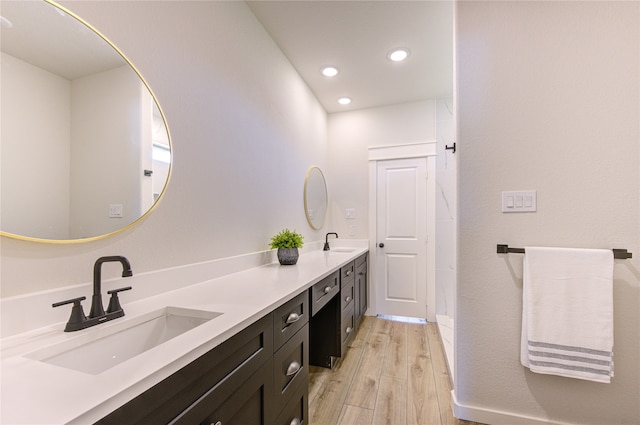 bathroom with wood-type flooring and vanity