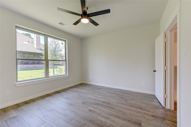 unfurnished room featuring ceiling fan and light hardwood / wood-style flooring