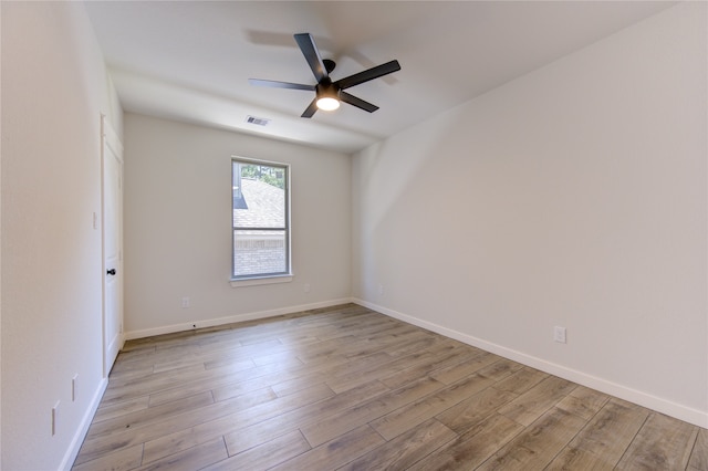 spare room featuring ceiling fan and light hardwood / wood-style flooring