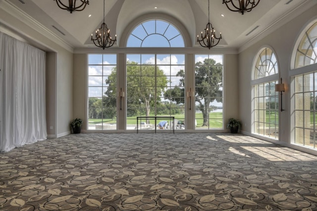 interior space with an inviting chandelier, vaulted ceiling, and french doors