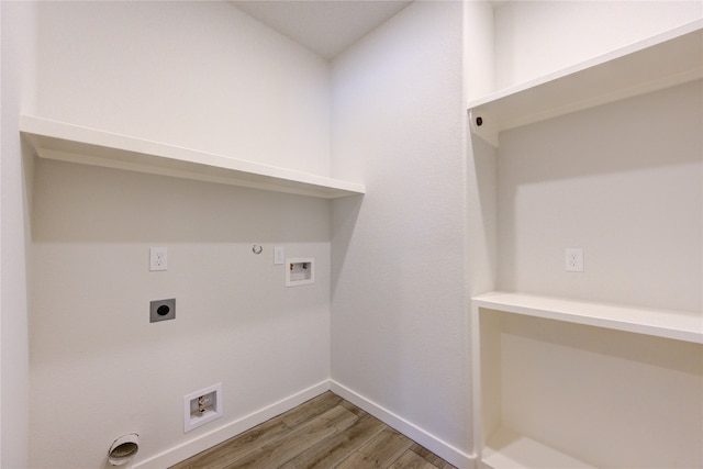 laundry room featuring washer hookup, hardwood / wood-style flooring, hookup for a gas dryer, and hookup for an electric dryer