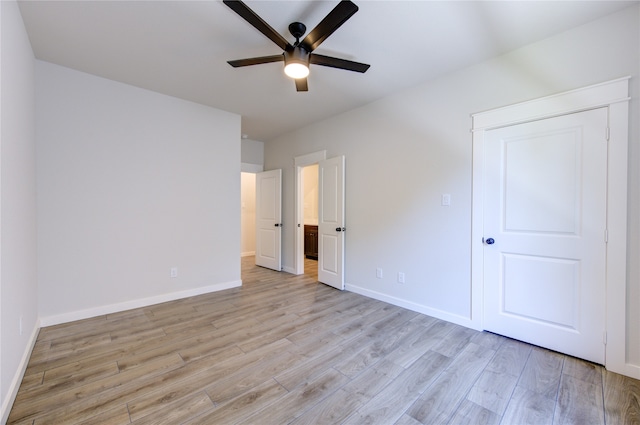 unfurnished bedroom with light wood-type flooring and ceiling fan