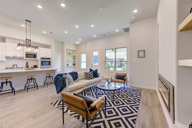 living room featuring light wood-type flooring