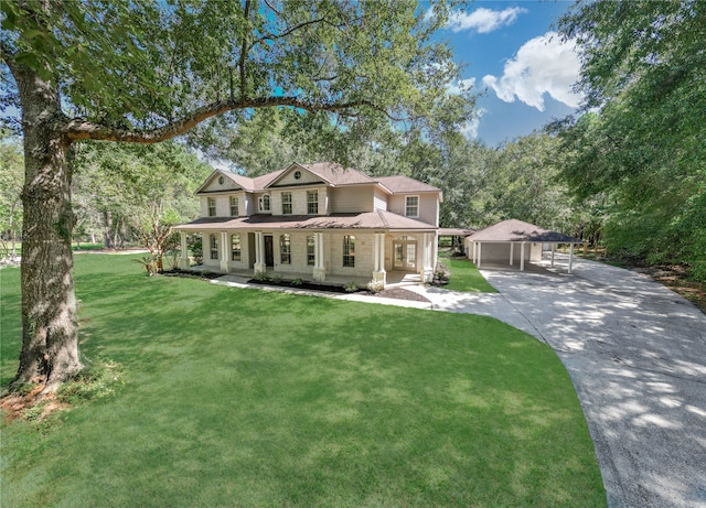 view of front of home featuring a carport, a porch, and a front lawn