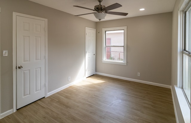 unfurnished bedroom featuring light hardwood / wood-style floors and ceiling fan