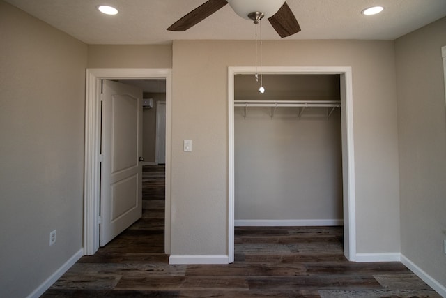 unfurnished bedroom featuring a closet, ceiling fan, and dark hardwood / wood-style floors