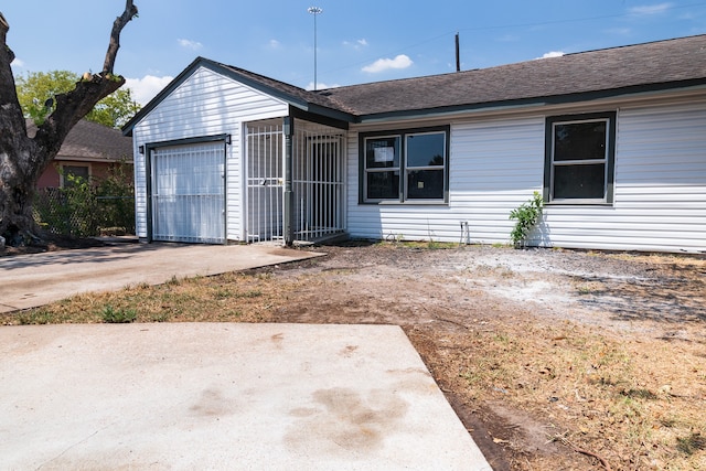 ranch-style home with a garage