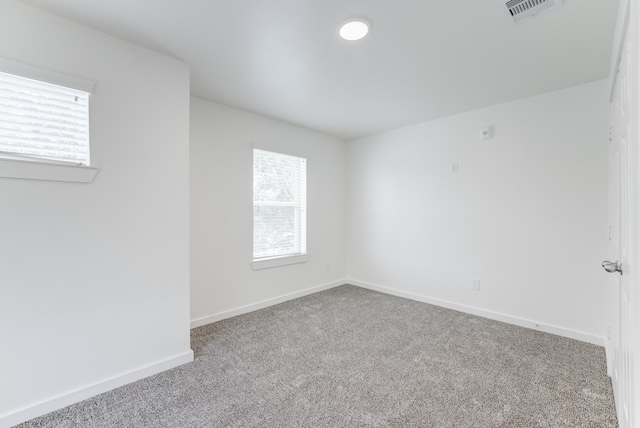 empty room featuring carpet floors