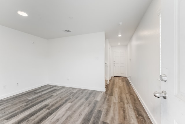 empty room featuring hardwood / wood-style floors