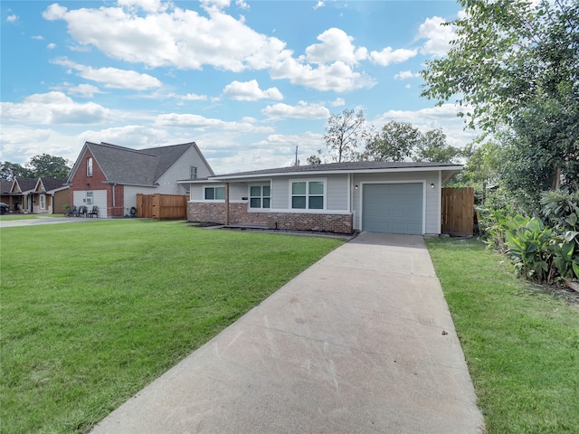 ranch-style home featuring a front yard and a garage