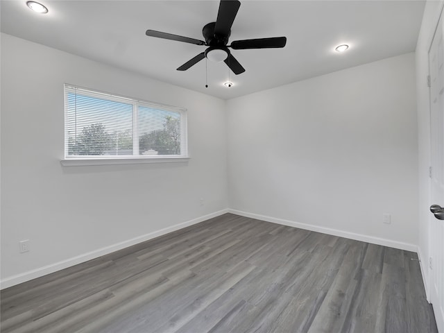 unfurnished room with ceiling fan and hardwood / wood-style flooring