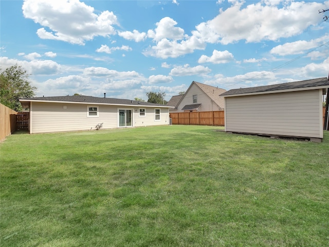 back of house with a yard