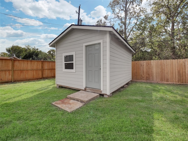 view of outdoor structure featuring a yard