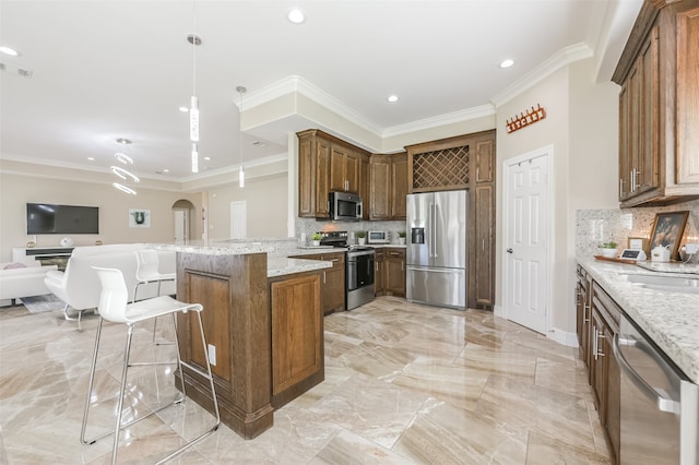 kitchen featuring appliances with stainless steel finishes, backsplash, kitchen peninsula, light stone countertops, and crown molding