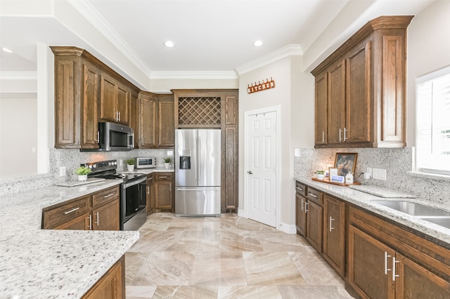 kitchen featuring ornamental molding, light stone countertops, stainless steel appliances, and tasteful backsplash