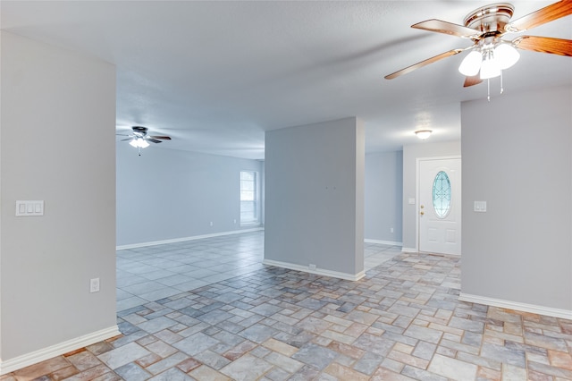 unfurnished room featuring ceiling fan