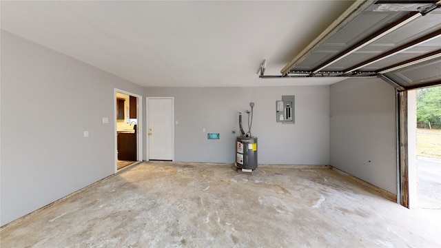 garage featuring water heater and electric panel