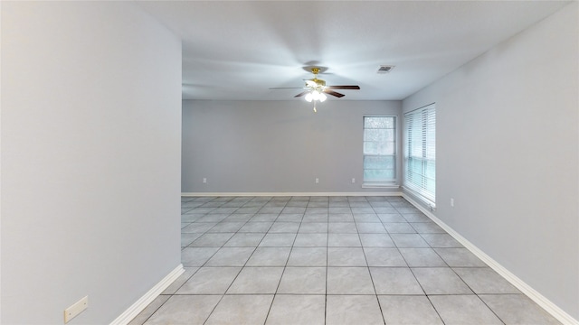 unfurnished room featuring ceiling fan and light tile patterned floors