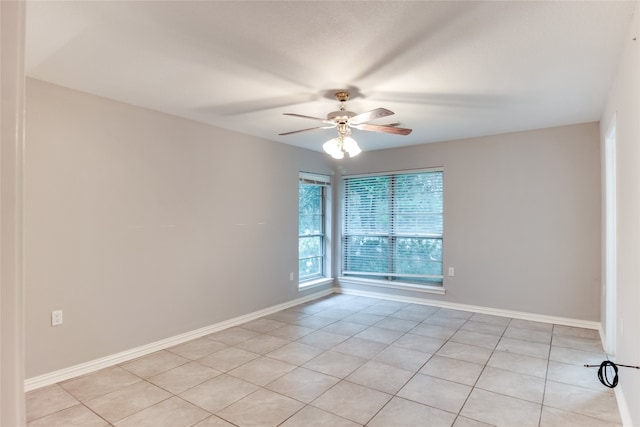 unfurnished room with light tile patterned flooring and ceiling fan