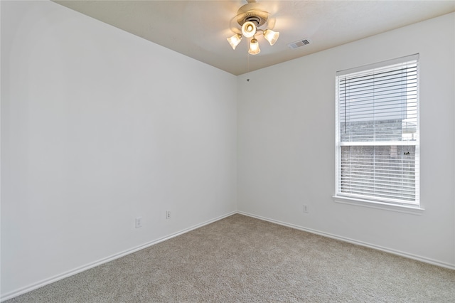 carpeted empty room featuring ceiling fan