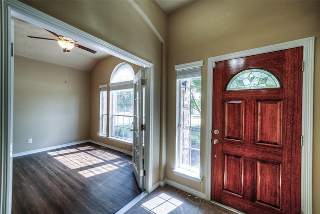 foyer entrance featuring lofted ceiling, hardwood / wood-style floors, ceiling fan, and a healthy amount of sunlight