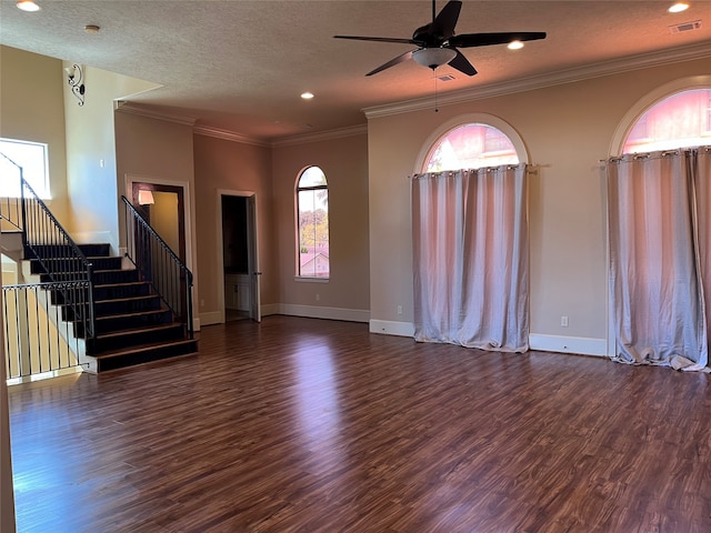 unfurnished living room with ornamental molding, a textured ceiling, ceiling fan, and dark hardwood / wood-style flooring