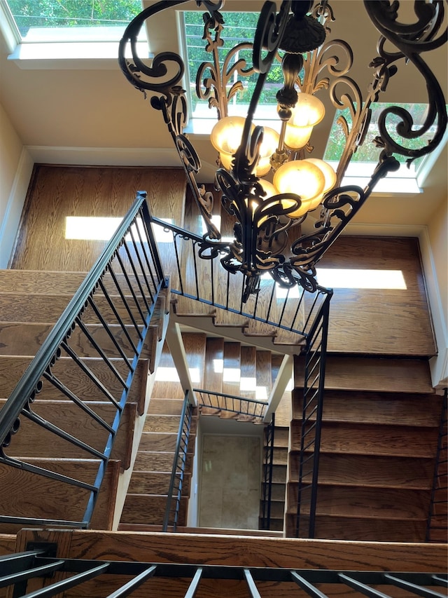 stairway featuring an inviting chandelier