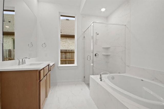 bathroom featuring vanity and shower with separate bathtub