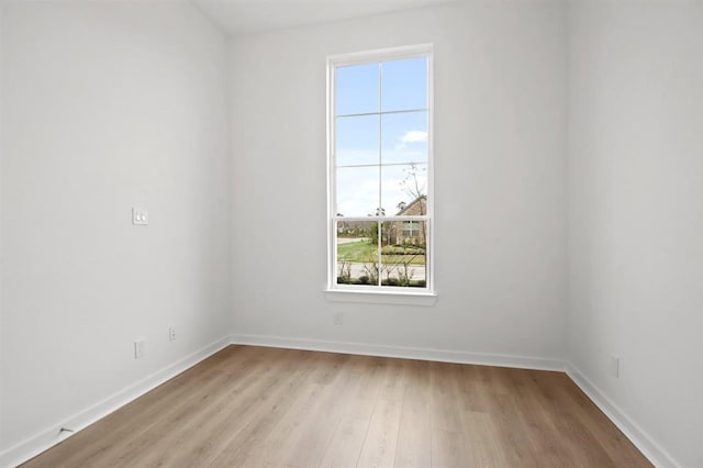 spare room with light hardwood / wood-style flooring