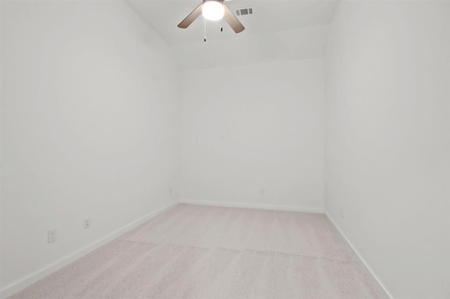 unfurnished room with ceiling fan, light colored carpet, and lofted ceiling