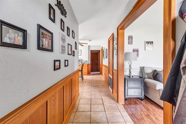 corridor with light hardwood / wood-style flooring