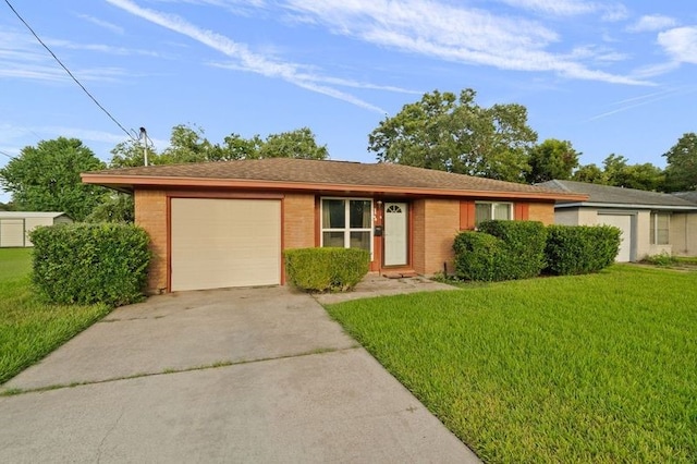 ranch-style home featuring a garage and a front lawn