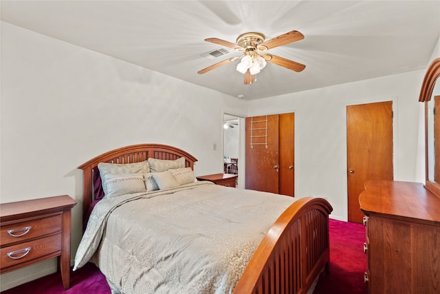 bedroom with dark colored carpet and ceiling fan