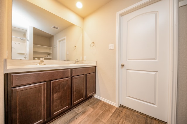 bathroom featuring vanity and hardwood / wood-style flooring