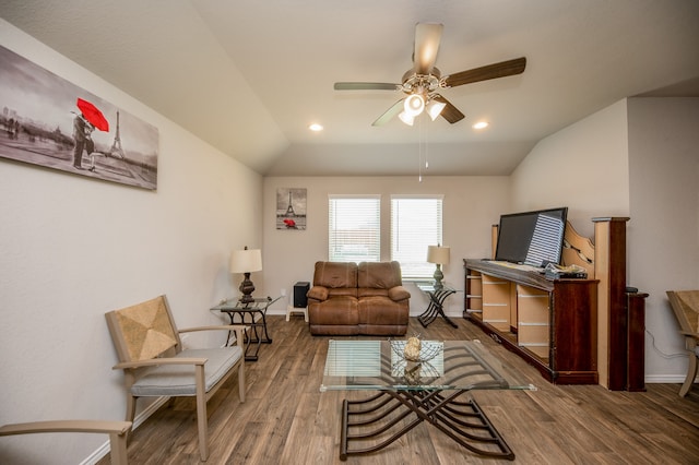 living room featuring ceiling fan, hardwood / wood-style flooring, and lofted ceiling