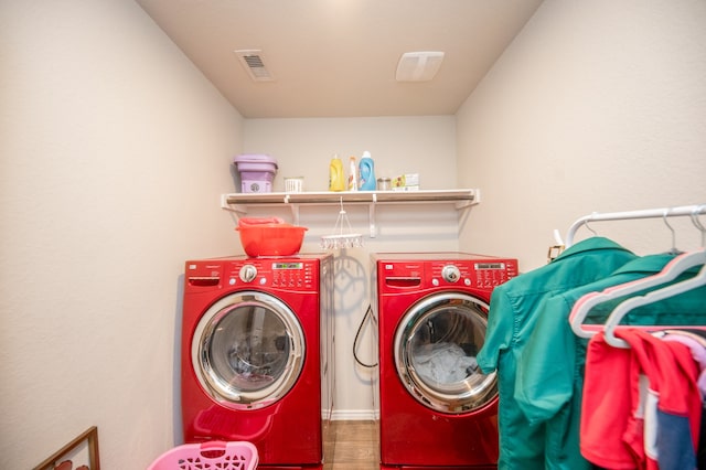 washroom featuring washer and dryer