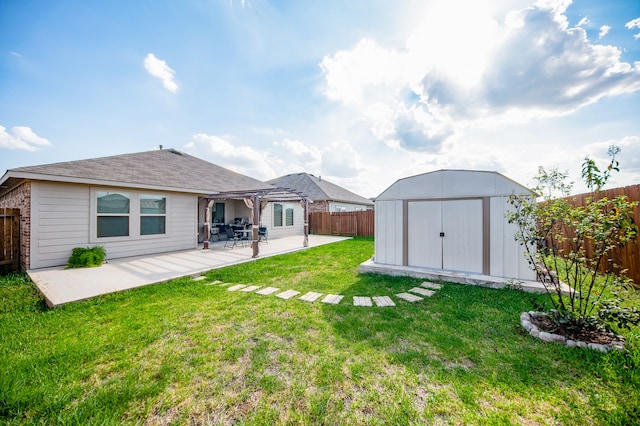 view of yard featuring a patio and a storage shed