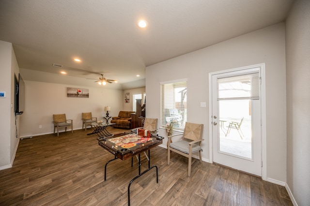 interior space with dark hardwood / wood-style flooring and ceiling fan