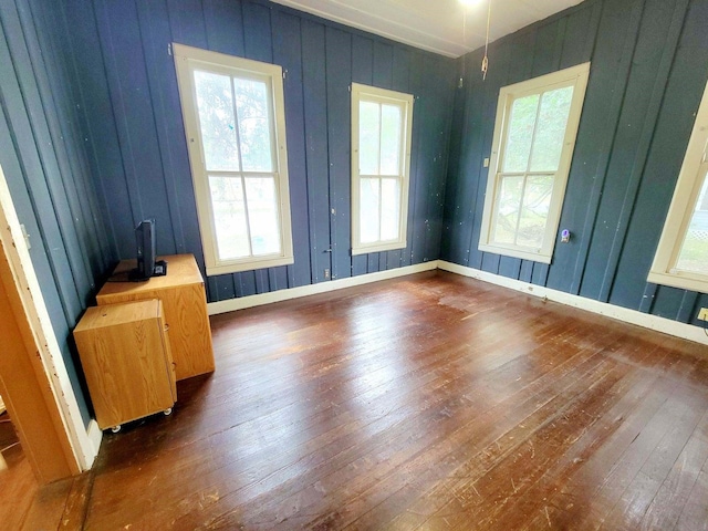 empty room with dark hardwood / wood-style floors