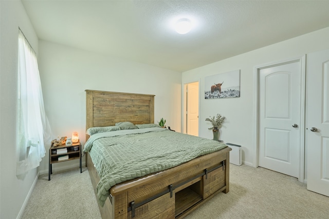 bedroom with light carpet