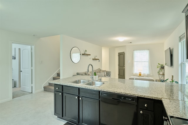 kitchen with black dishwasher, sink, and light stone counters