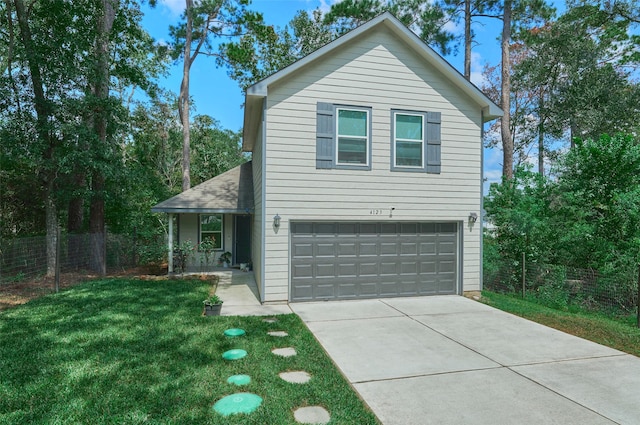 view of property with a garage and a front yard