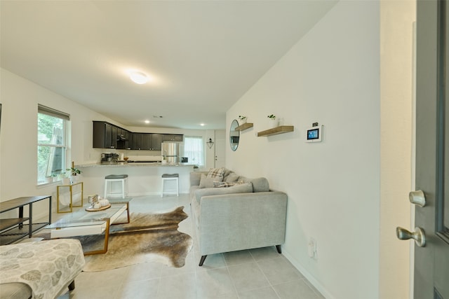 living room featuring light tile patterned floors