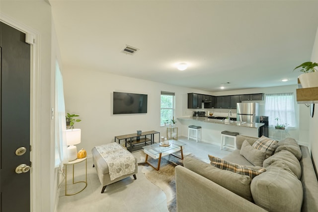 tiled living room with sink