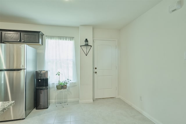 interior space with light tile patterned floors