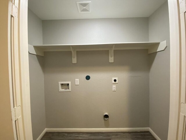 laundry area featuring hookup for a gas dryer, washer hookup, dark wood-type flooring, and electric dryer hookup