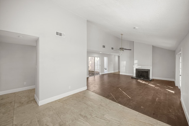 unfurnished living room with ceiling fan, high vaulted ceiling, and light wood-type flooring